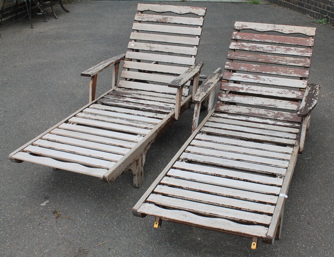 Appraisal: Two Lister teak folding steamer deck chairs with slated frames