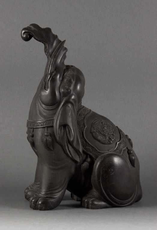 Appraisal: Chinese patinated bronze figure of a seated elephant th or