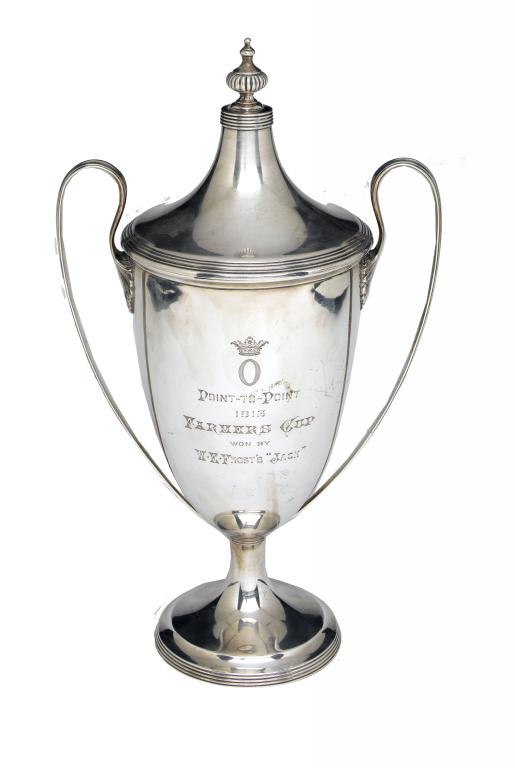 Appraisal: A GEORGE V CUP AND COVER of shield shape with