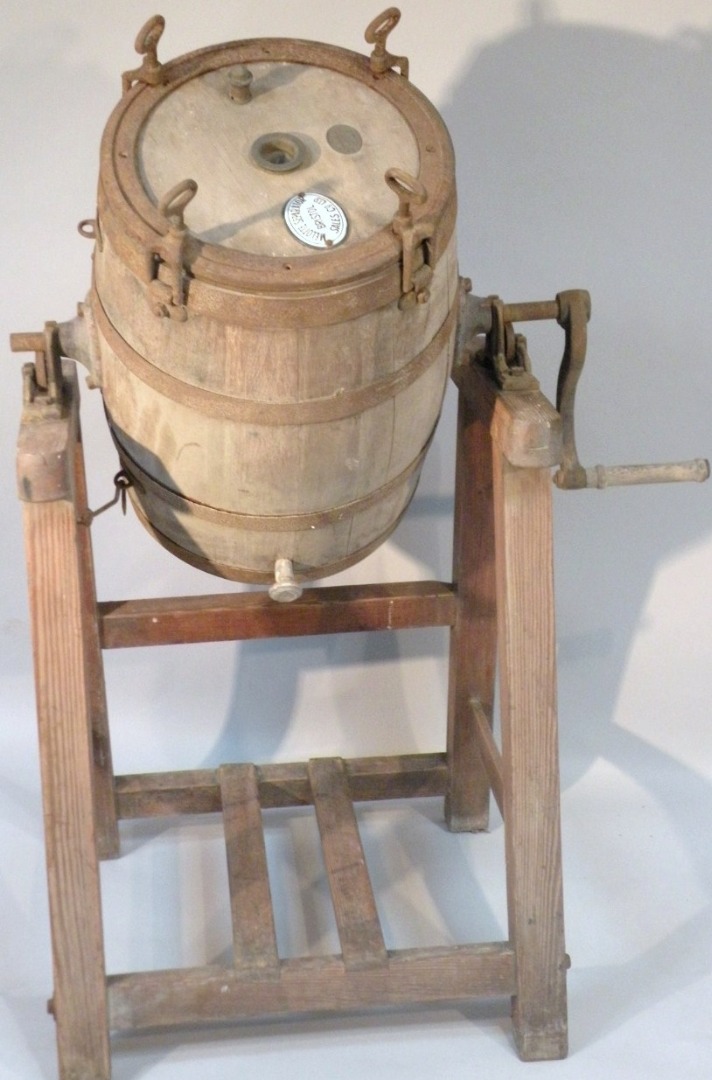 Appraisal: A late thC Melotte butter churn the oak body with