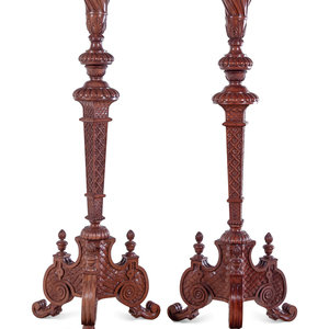 Appraisal: A Pair of Continental Carved Walnut Torch res th Century