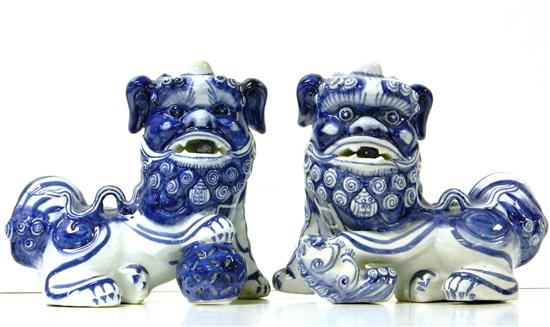 Appraisal: Pair blue and white porcelain Foo dogs one with pierced