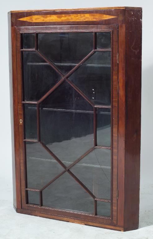 Appraisal: MAHOGANY GLAZED HANGING CORNER CUPBOARD EARLY th CENTURY with astragal