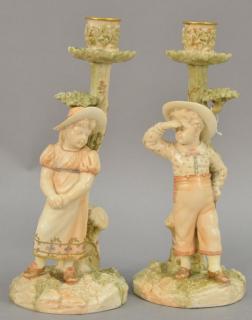 Appraisal: Pair of Royal Worcester figural candlesticks boy and girl with