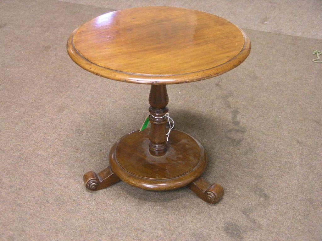 Appraisal: A Victorian circular mahogany occasional table on turned stem circular