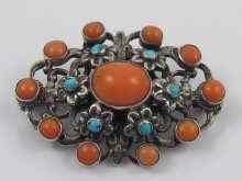 Appraisal: A fine antique sterling silver brooch set with coral and