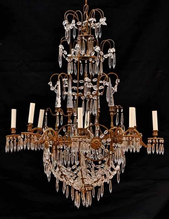 Appraisal: BALTIC NEOCLASSICAL GILT-METAL AND CUT-GLASS EIGHT-LIGHT CHANDELIER The pear-form skeletal