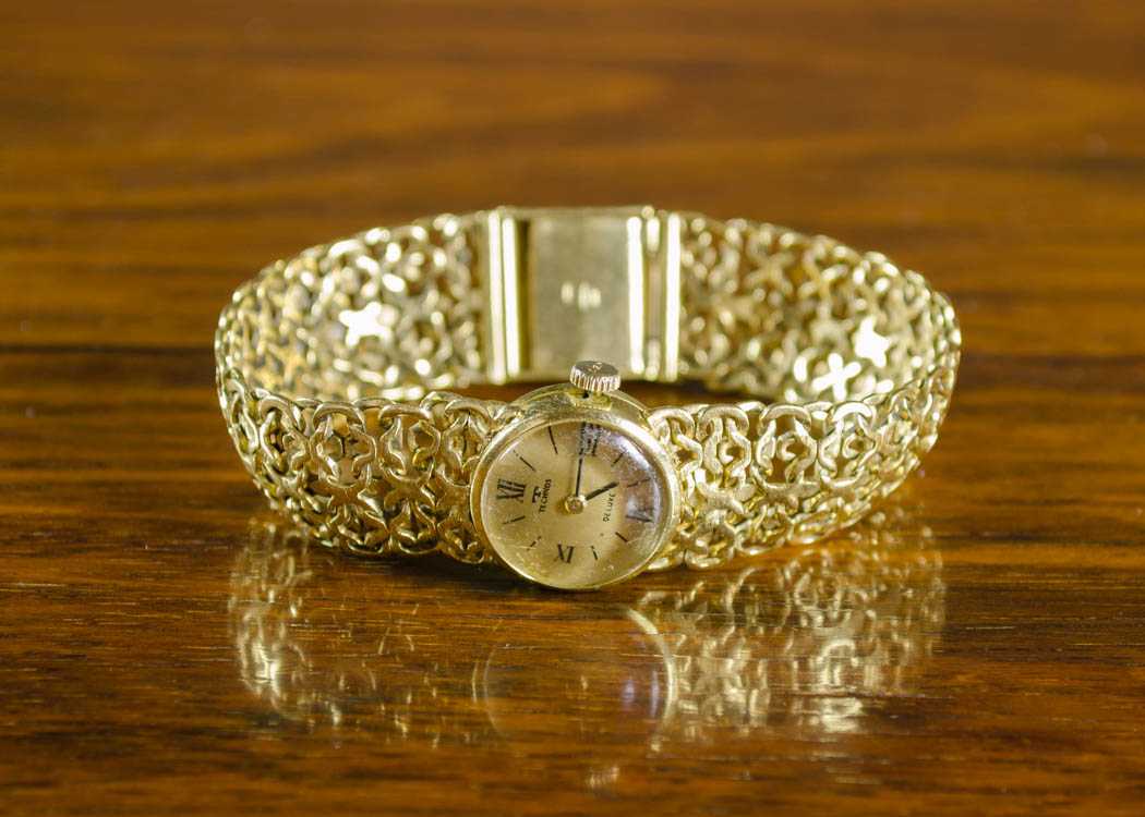 Appraisal: LADY'S FOURTEEN KARAT GOLD INTEGRAL BRACELET WRIST WATCH Technos Watch