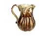 Appraisal: A CREAMWARE TORTOISESHELL GLAZED CREAM JUG of baluster shape with