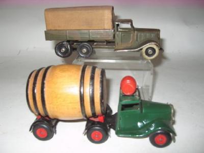 Appraisal: Two Minic clockwork tinplate toys comprising Whatney's Red Barrel six