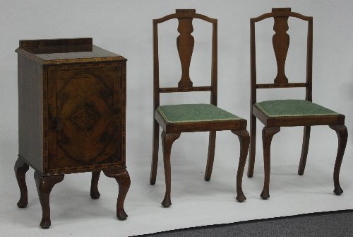 Appraisal: A walnut and inlaid bedside cupboard fitted a panel door