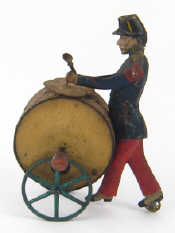 Appraisal: A vintage tinplate inertia drive marching soldier playing a drum