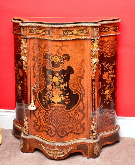 Appraisal: A FRENCH SERPENTINE MARQUETRY SIDE CABINET circa with gilt metal