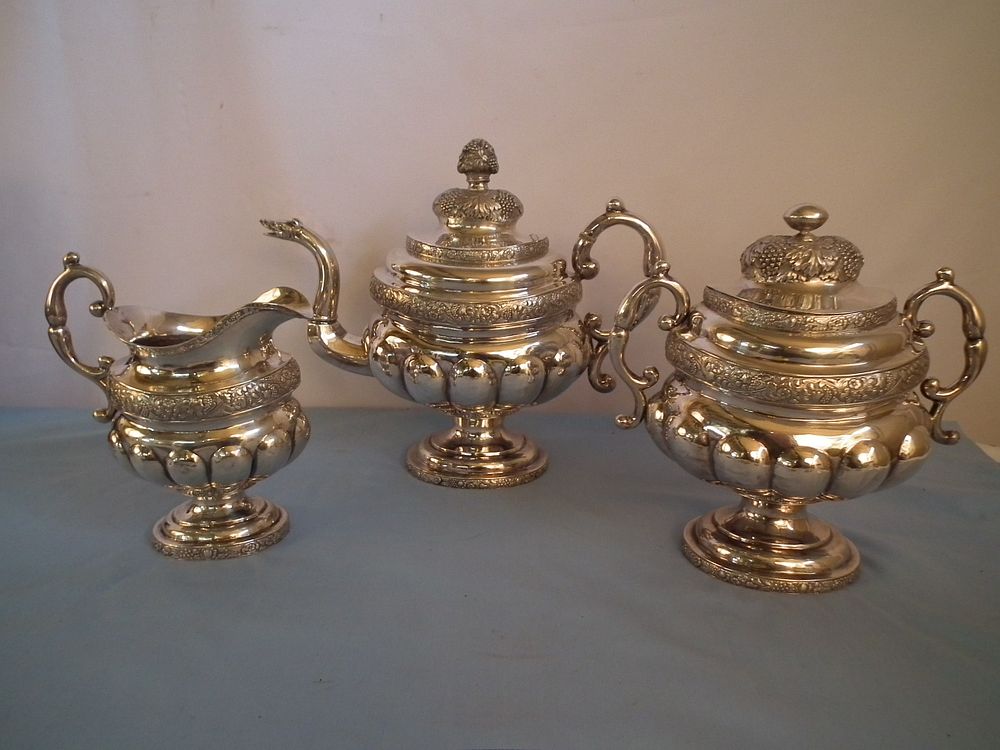 Appraisal: ANTIQUE COIN SILVER TEA SET Oversized antique coin silver teapot