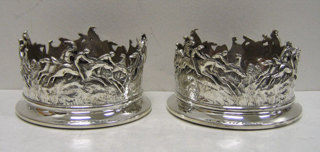 Appraisal: PAIR OF SHEFFIELD PLATED SILVER COASTERS Cylindrical straight sided molded