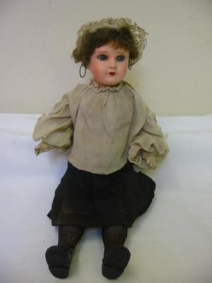 Appraisal: A German composition doll with blue glass sleeping eyes open