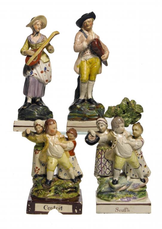 Appraisal: TWO STAFFORDSHIRE PEARLWARE GROUPS OF THE CONTEST AND SCUFFLE each