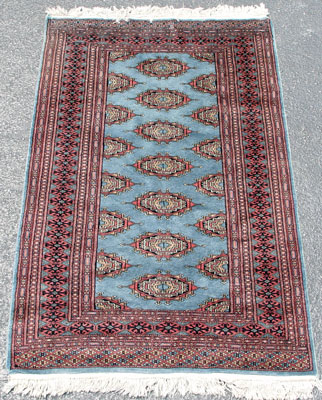 Appraisal: HAND TIED TURKISH RUG Rose black and blue geometric design