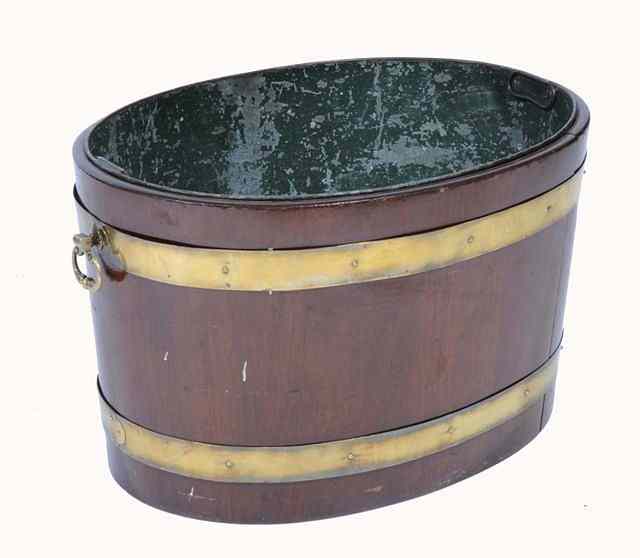 Appraisal: A GEORGE III BRASS BOUND MAHOGANY OVAL WINE COOLER with