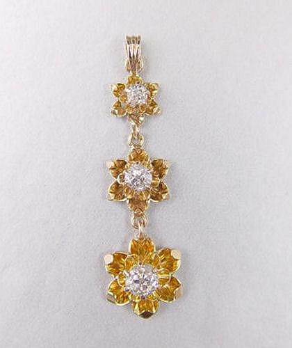 Appraisal: STONE EDWARDIAN DROP PENDANT K yellow gold diamond pendant contains