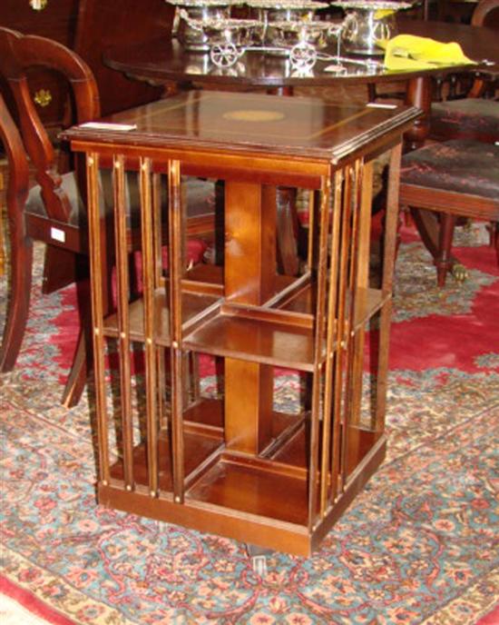 Appraisal: English inlaid mahogany revolving bookcase molded top with round linenfold