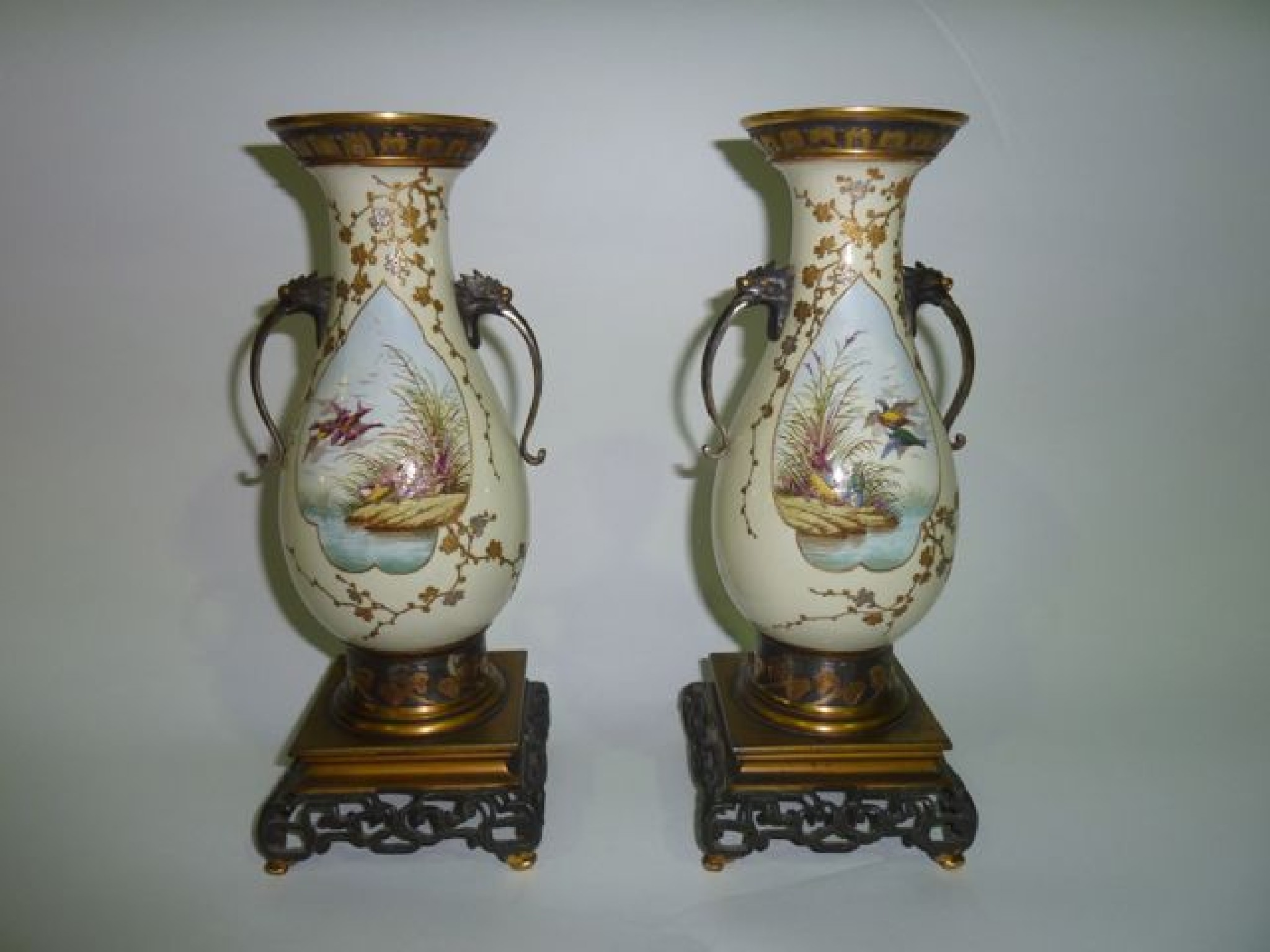 Appraisal: A pair of green ground late th century ceramic vases