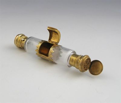 Appraisal: A Victorian silvergilt mounted double-ended clear glass scent bottle and