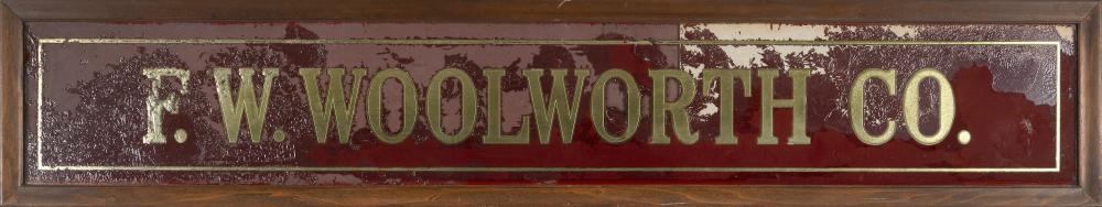 Appraisal: WOOLWORTH CO REVERSE-PAINTED GLASS TRADE SIGN TH CENTURY FRAMED X