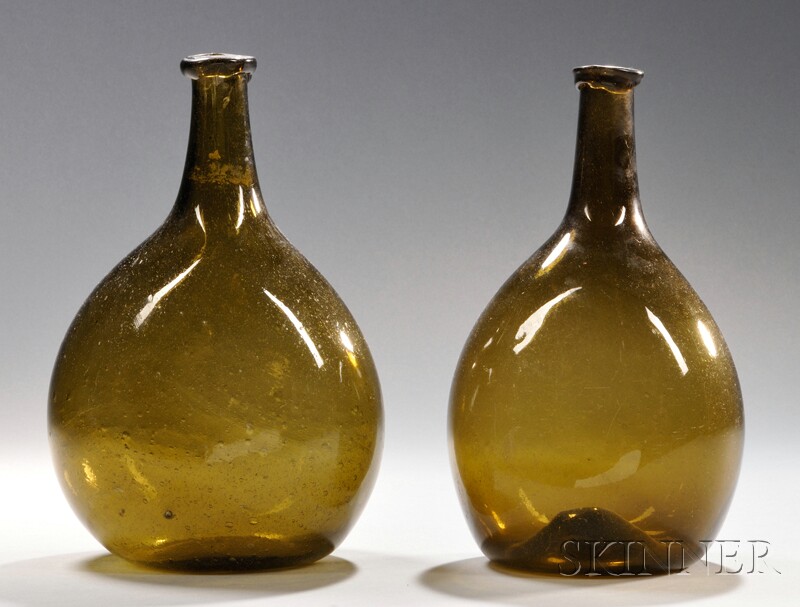 Appraisal: Two Free-blown Olive-amber Chestnut Bottles probably New England - with