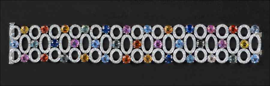 Appraisal: DIAMOND MULTI-COLORED SAPPHIRE AND KARAT WHITE GOLD BRACELET round brilliant