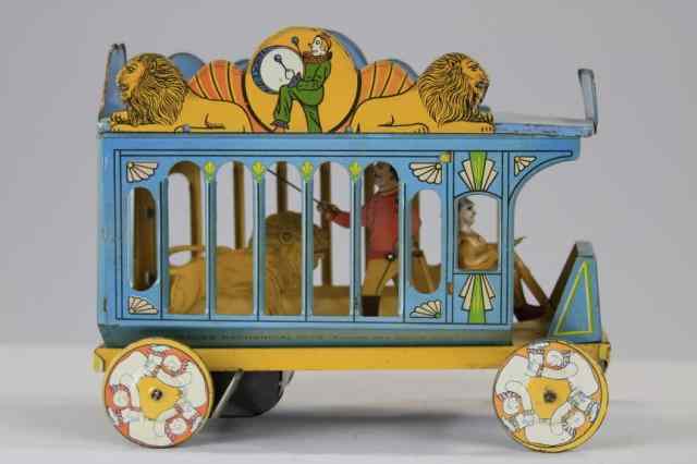 Appraisal: STRAUSS CIRCUS WAGON Lithographed tin cage wagon body contains lion