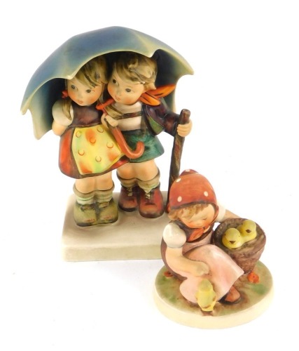 Appraisal: A Hummel pottery figure modelled as Stormy Weather and another