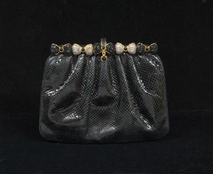 Appraisal: Judith Leiber black reptile clutch purse With black and white