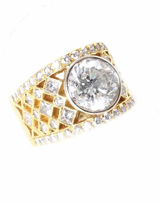 Appraisal: Diamond and gold ring ct round brilliant-cut bezel-set diamond color