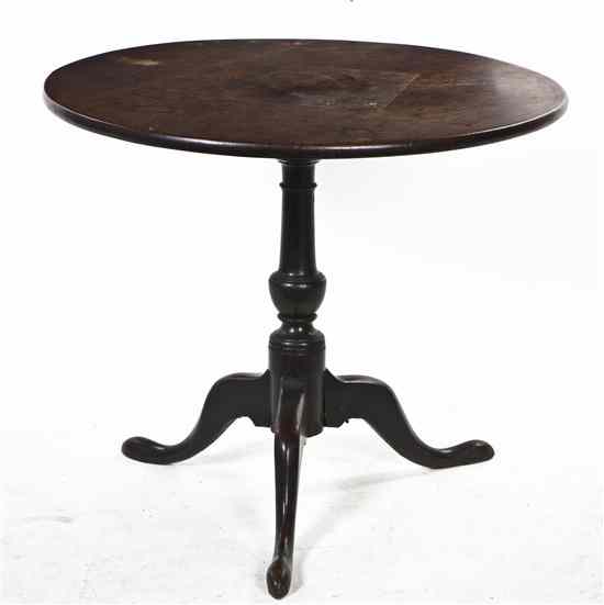 Appraisal: An English Oak Occasional Table the circular top set on