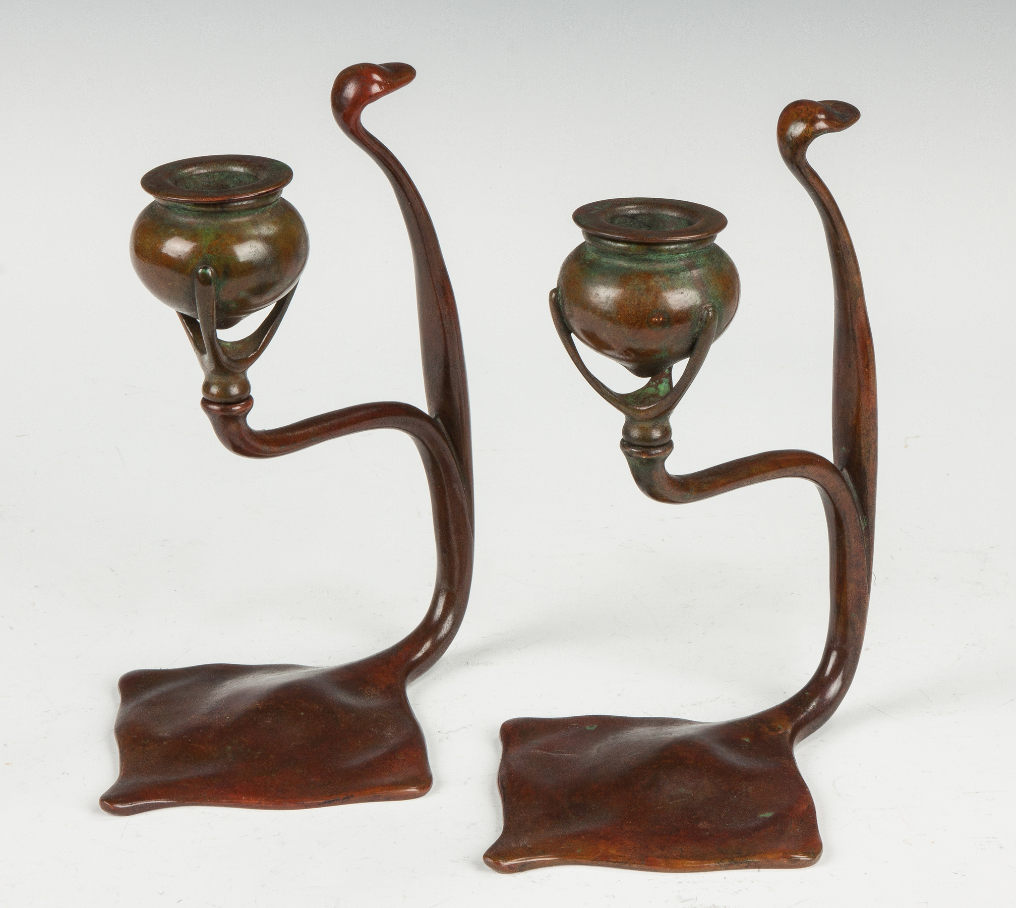 Appraisal: A Pair of Tiffany Bronze Candle Holders Sgn Tiffany Studios