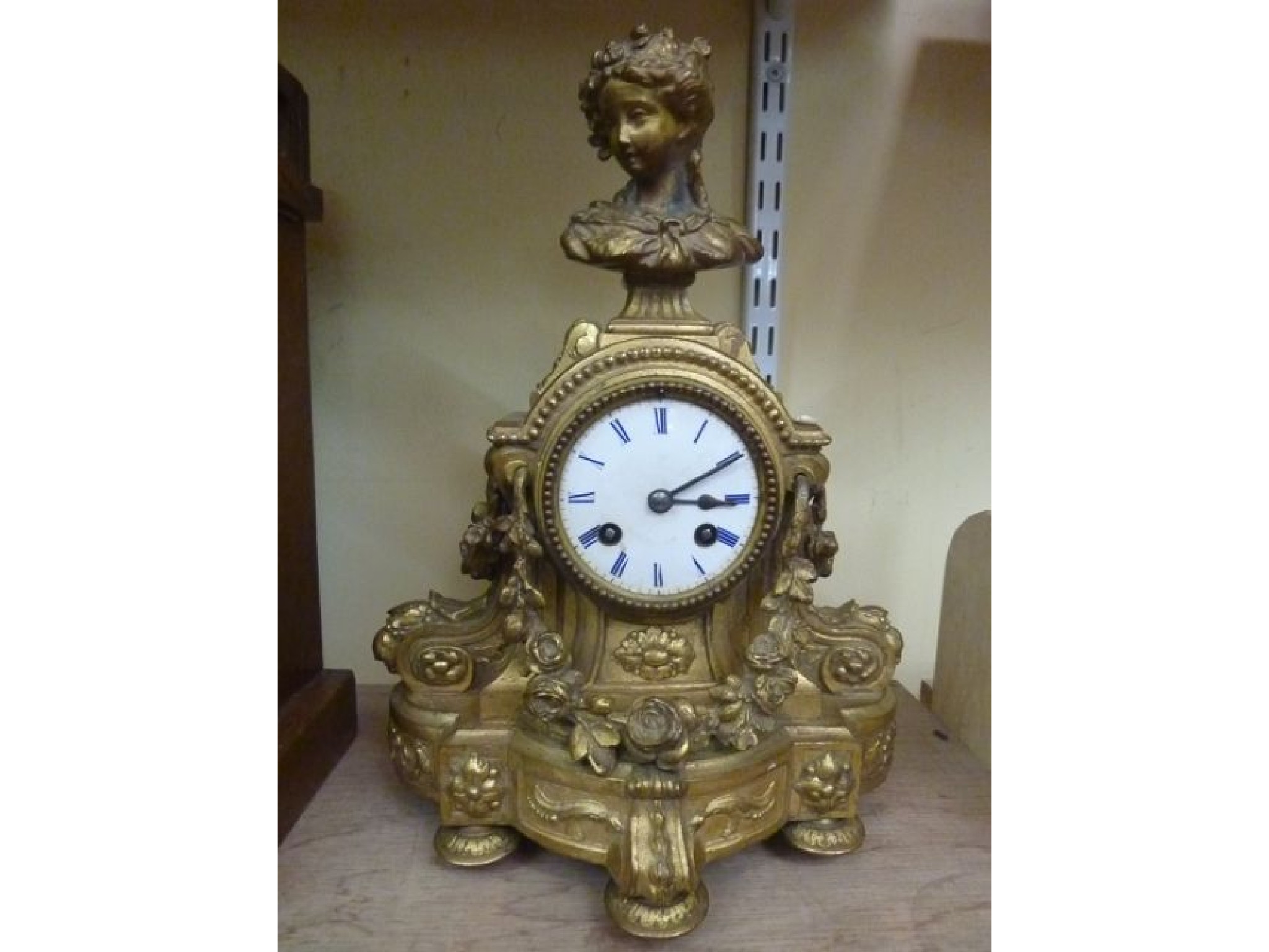 Appraisal: A th century gilded mantle clock the case with floral