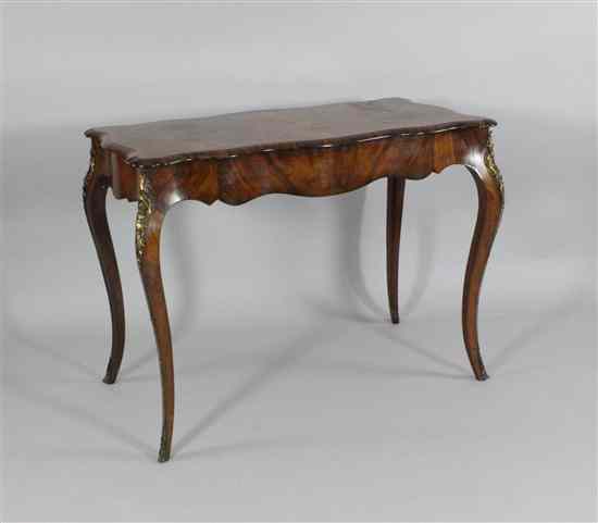 Appraisal: A Victorian walnut serpentine side table with drawer on cabriole