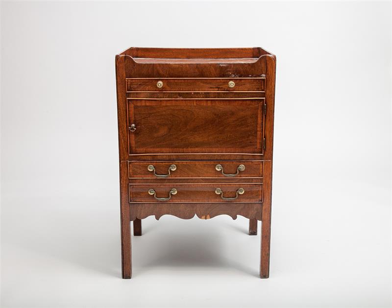 Appraisal: George III Style Mahogany Bedside Cupboard Containing a shallow frieze