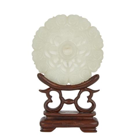 Appraisal: A Celadon White Jade Floral Pendant with a Rosewood Stand