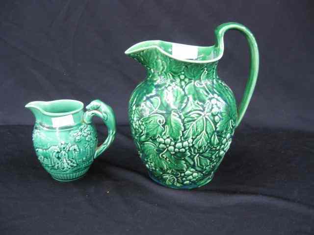 Appraisal: Wedgwood Majolica Pitchers '' foxhunt scene and '' grape vine