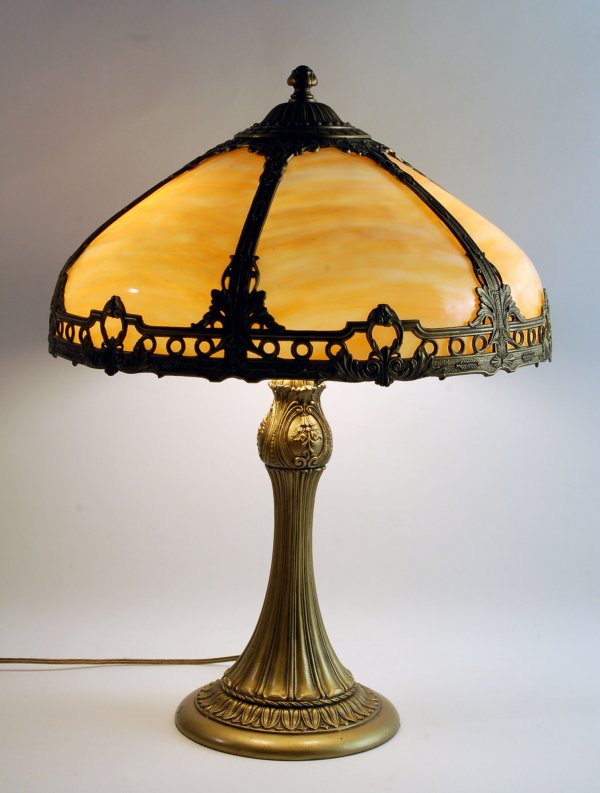 Appraisal: Caramel slag glass table lamp with panel shade Cast metal