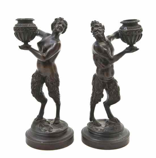 Appraisal: A Pair of Neoclassical Bronze Figural Candlesticks cast as a