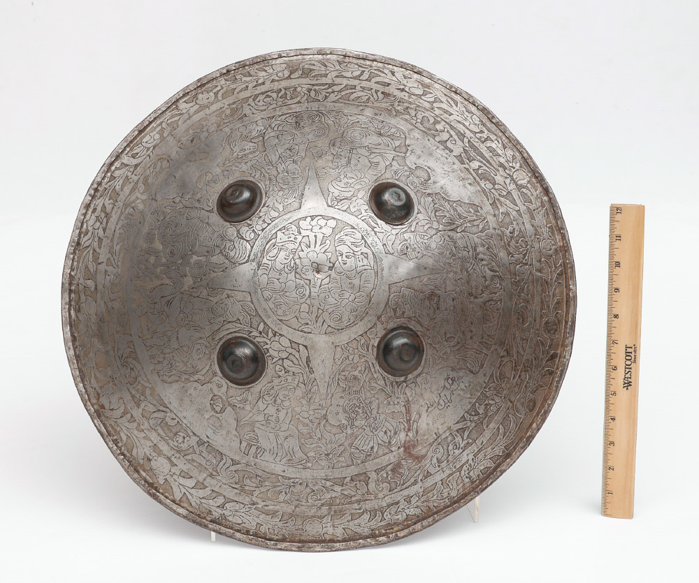 Appraisal: INDO-PERSIAN STEEL SIPAR SHIELD Circa th century engraved figures horses