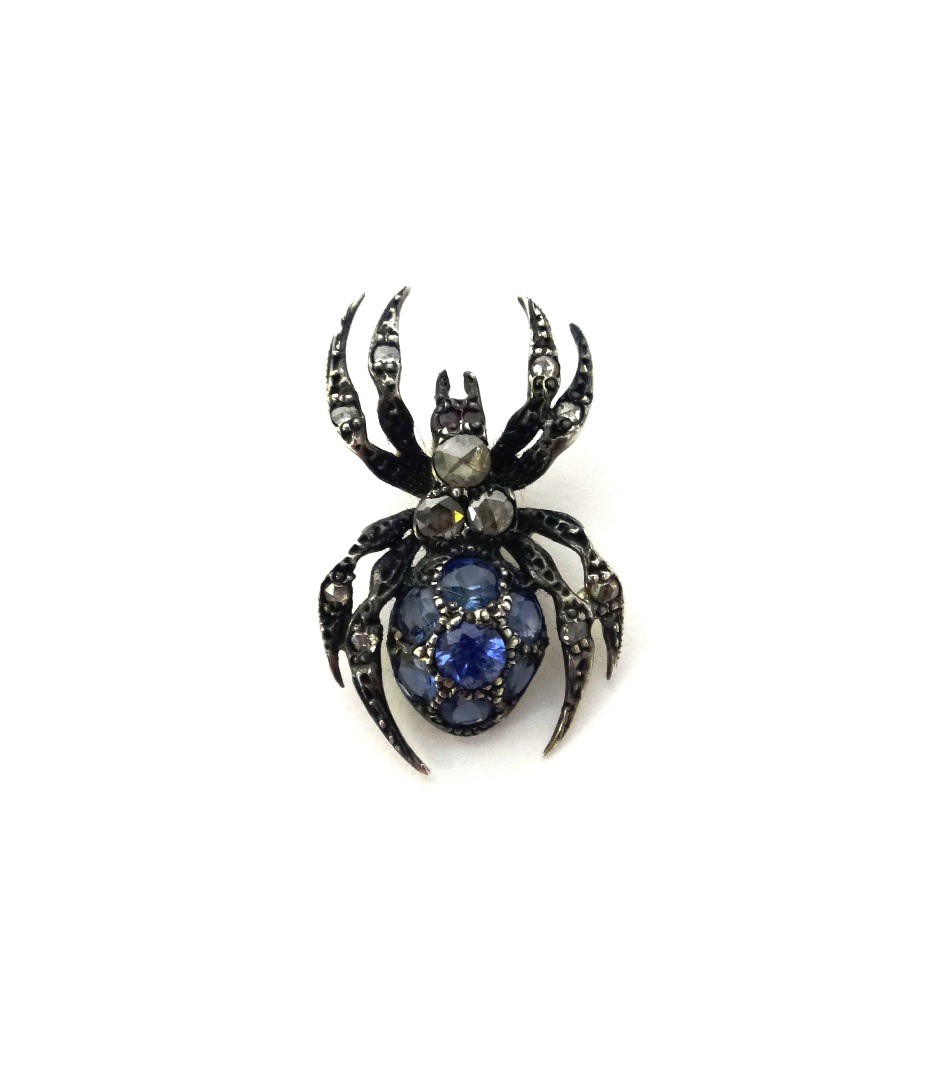 Appraisal: A sapphire and diamond set pendant designed as a spider