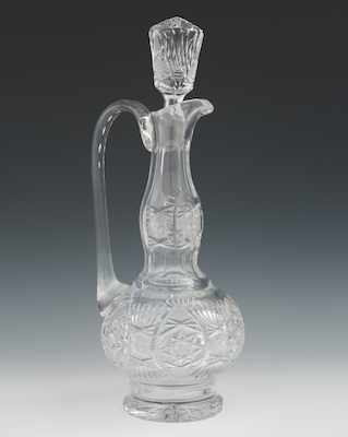 Appraisal: A Brilliant Cut Crystal Ewer Shape Decanter with Stopper Measuring