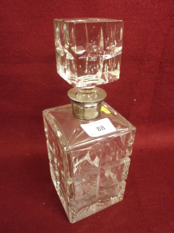 Appraisal: A cut glass square section decanter and stopper with a