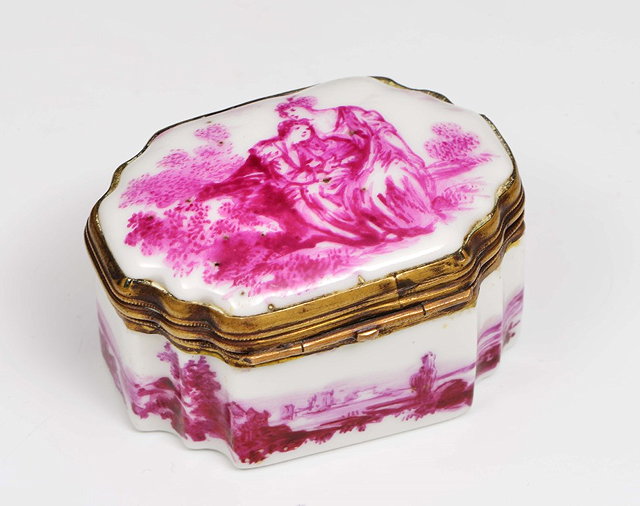 Appraisal: A CONTINENTAL CERAMIC BOX OF SHAPED FORM with painted puce