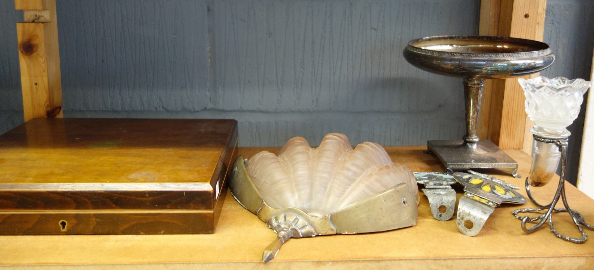 Appraisal: An Art Deco gilt metal wall light with pink frosted