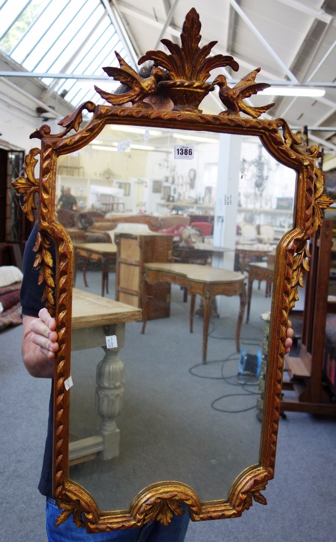 Appraisal: A th century gilt framed shaped rectangular oval mirror with